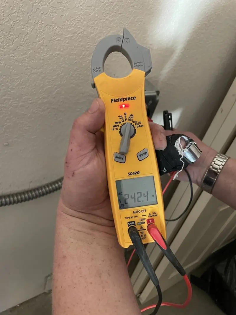 Voltage testing with clamp meter during Electrical Installation Services in Rolling Meadows